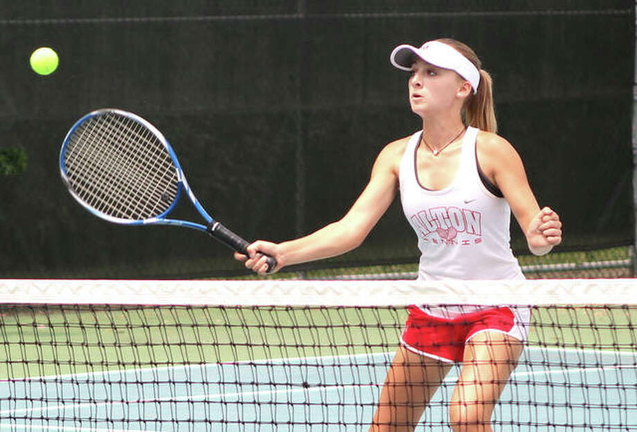 Ainsley Fortschneider hits a shot for a point at the net during the Andy Simpson Doubles Invitational girls tennis tournament Saturday at the LCCC’s Andy Simpson Tennis Complex in Godfrey. Photo: 





Greg Shashack / The Telegraph






