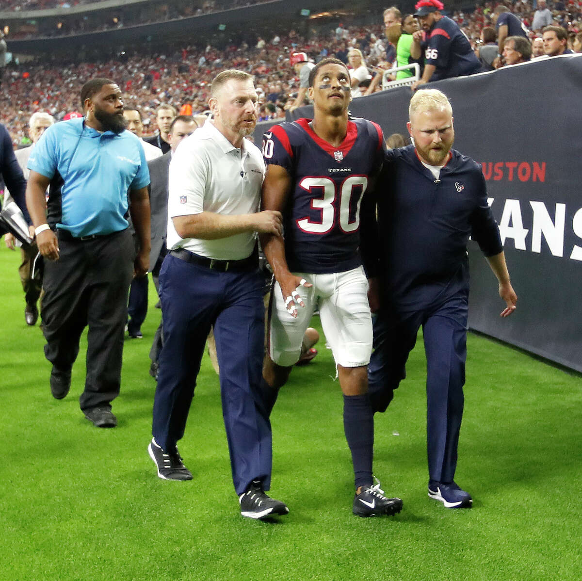 Houston Texans cornerback Kevin Johnson (30) is taken to the locker room after being injured on a play during the first quarter of an NLF preseason game at NRG Stadium, Saturday, August 18, 2018, in Houston.