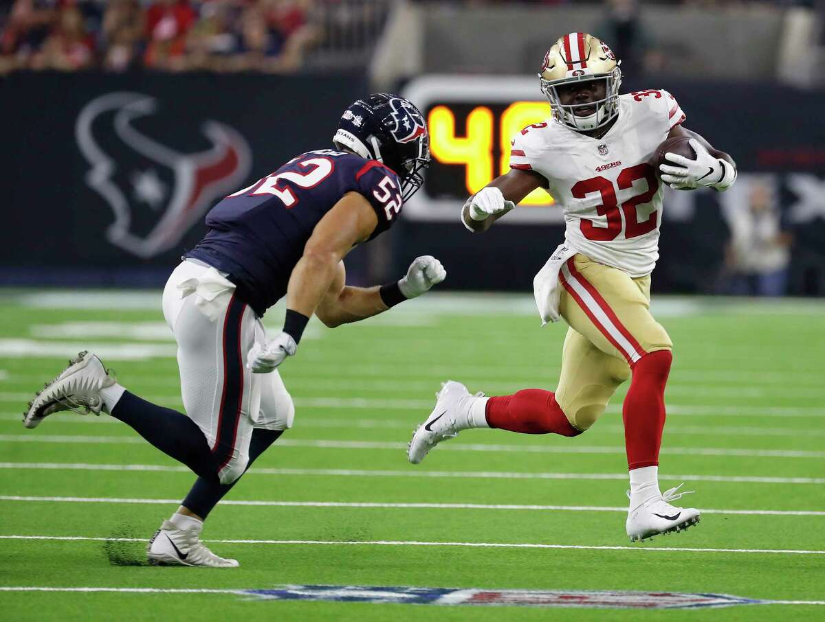 San Francisco 49ers running back Joe Williams (32) runs the ball against Houston Texans linebacker Brian Peters (52) during the first quarter of an NLF preseason game at NRG Stadium, Saturday, August 18, 2018, in Houston.