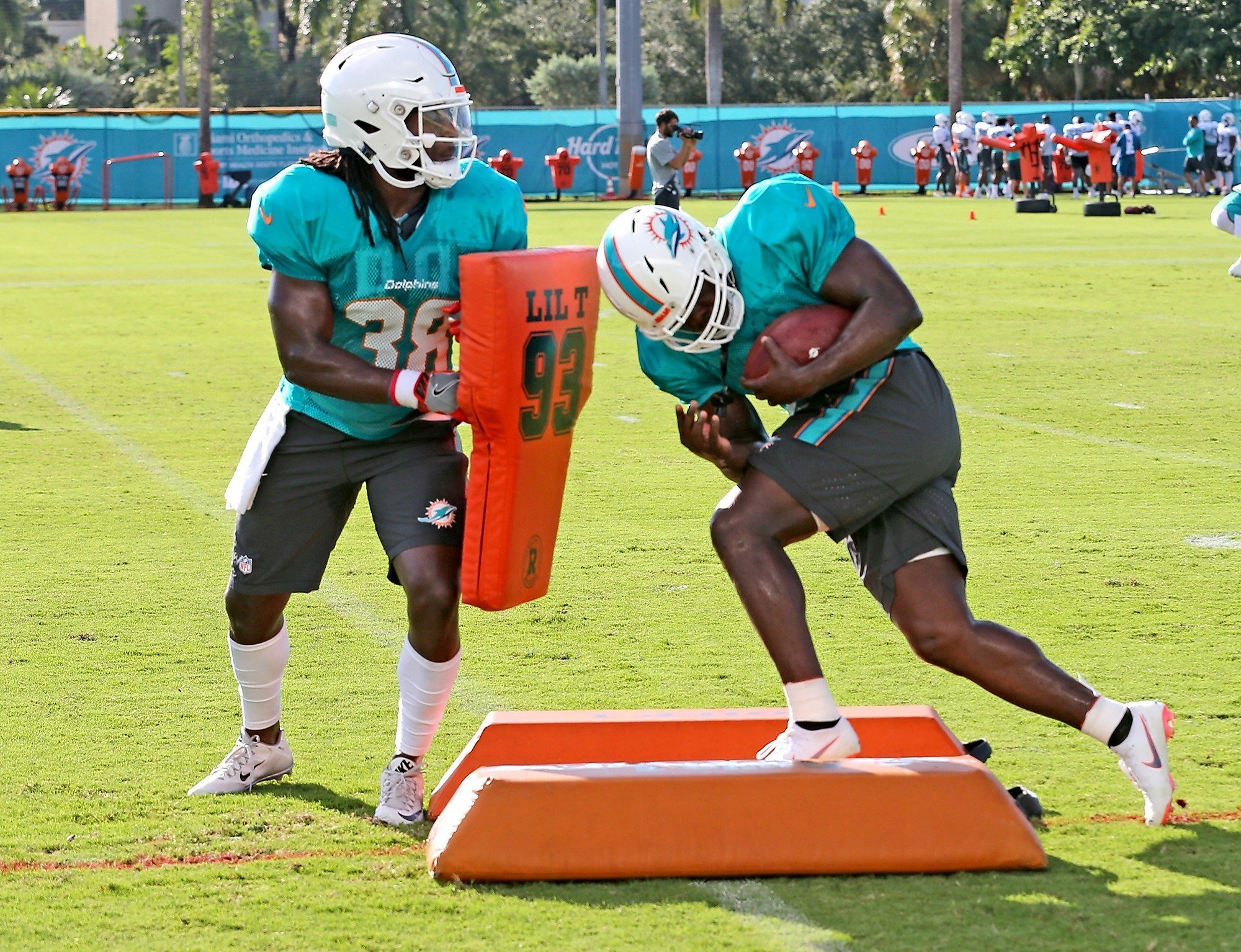 In this Monday, July 30, 2018, photo, running back Frank Gore (21) stands  on the field at the NFL football team's training camp in Davie, Fla. The  NFL's active career rushing leader