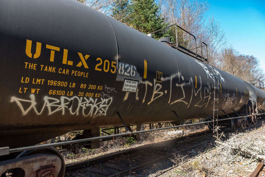 an old dot-111 oil tanker parked on a section of the