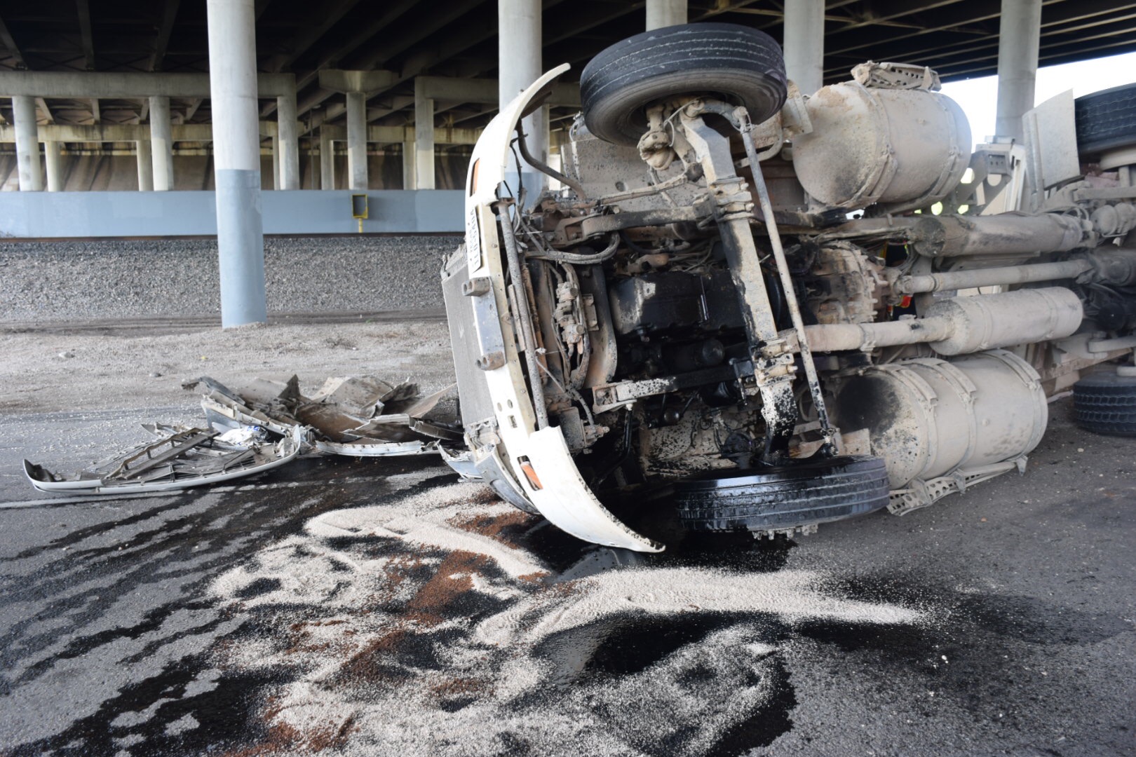 Driver hospitalized after gravel truck overturns on U.S. 90 exit ...
