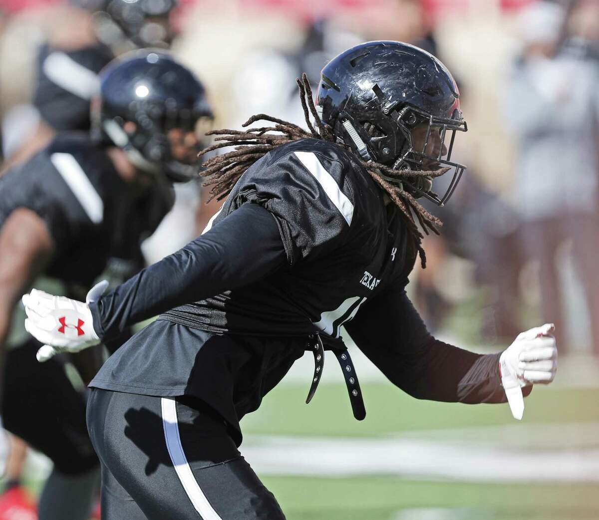 In this April 5, 2018 photo Texas Tech's Dakota Allen (40) runs down the field during NCAA college football practice in Lubbock, Texas. Allen still feels this is his last chance, even after a successful return to Texas Tech following a well-documented season at an East Mississippi junior college. After being Tech's second-leading tackler as a freshman in 2015, the linebacker was involved in an off-field incident which led to him being kicked off the team and out of school. He thought his football career was over. But he spent the 2016 season with the first team featured in Netflix's "Last Chance U" series, then got the opportunity to return to Texas Tech. He was a team captain last season and now goes into his senior year as a preseason All-Big 12 pick. (Brad Tollefson/Lubbock Avalanche-Journal via AP)