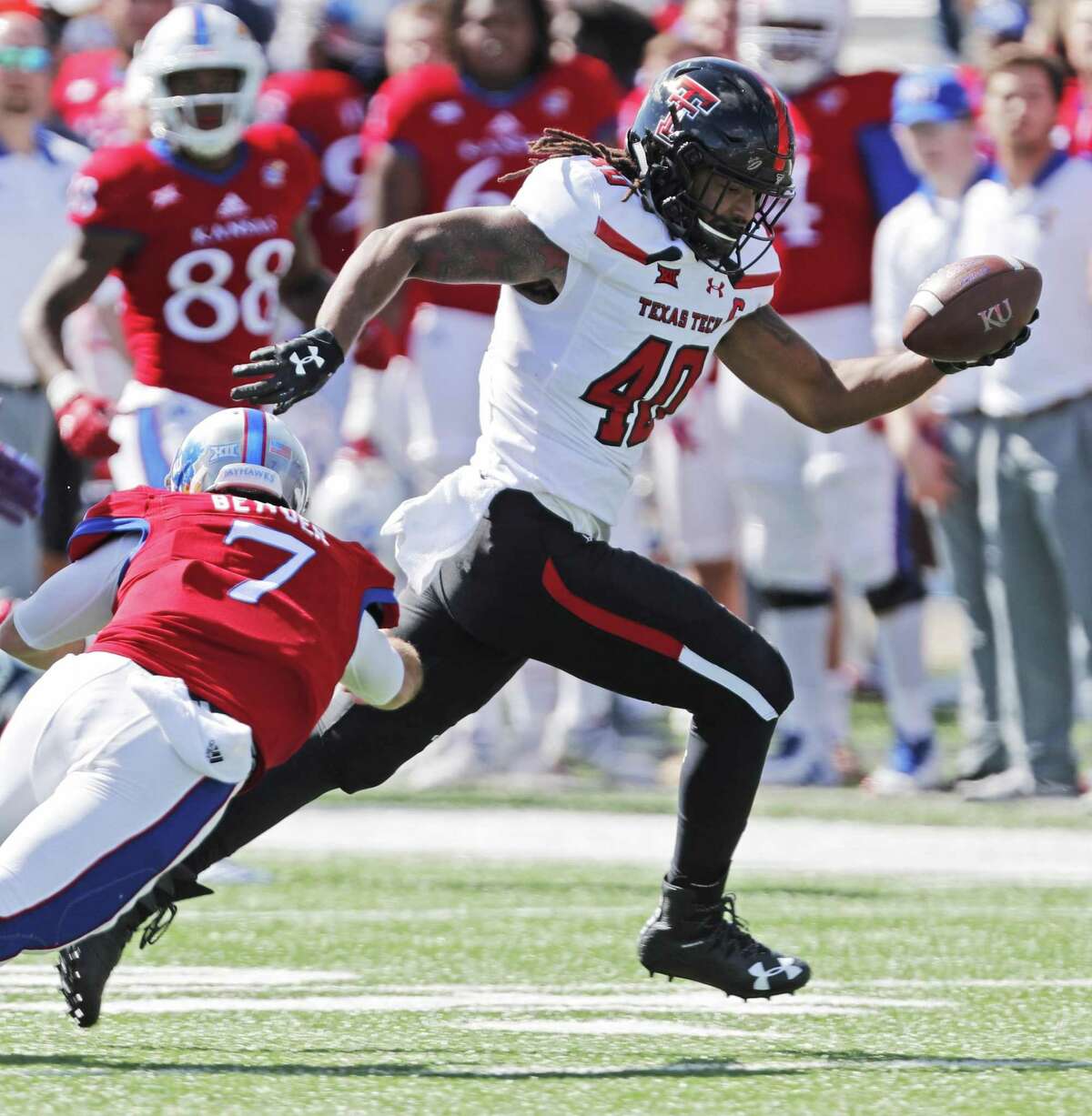 In this Oct. 7, 2017 photo 0Texas Tech's Dakota Allen (40) carries the ball after making a first half interception during the game against Kansas in Lawrence, Kan. Allen still feels this is his last chance, even after a successful return to Texas Tech following a well-documented season at an East Mississippi junior college. After being Tech's second-leading tackler as a freshman in 2015, the linebacker was involved in an off-field incident which led to him being kicked off the team and out of school. He thought his football career was over. But he spent the 2016 season with the first team featured in Netflix's "Last Chance U" series, then got the opportunity to return to Texas Tech. He was a team captain last season and now goes into his senior year as a preseason All-Big 12 pick. (Mark Rogers/Lubbock Avalanche-Journal via AP)