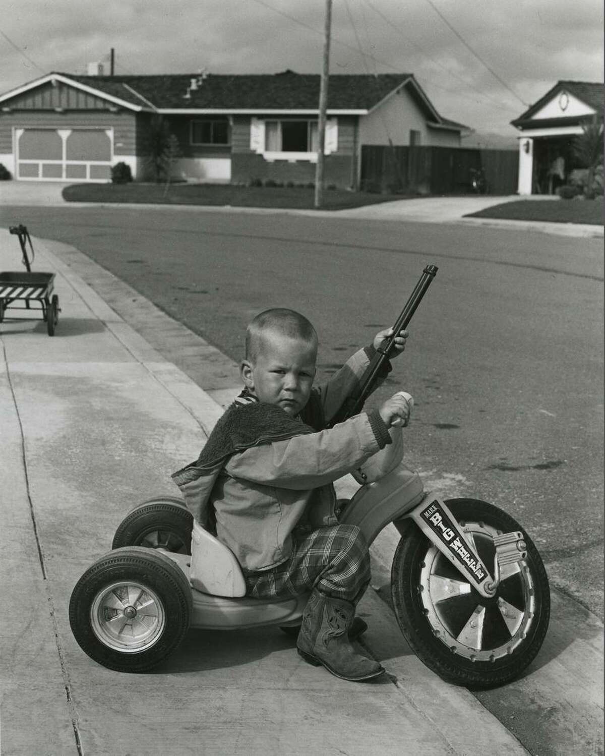 The mother of Richie Ferguson defended the 4-year-old’s playing with guns in a 1971 photo from Bill Owens’ book published in 1972, “Suburbia.”
