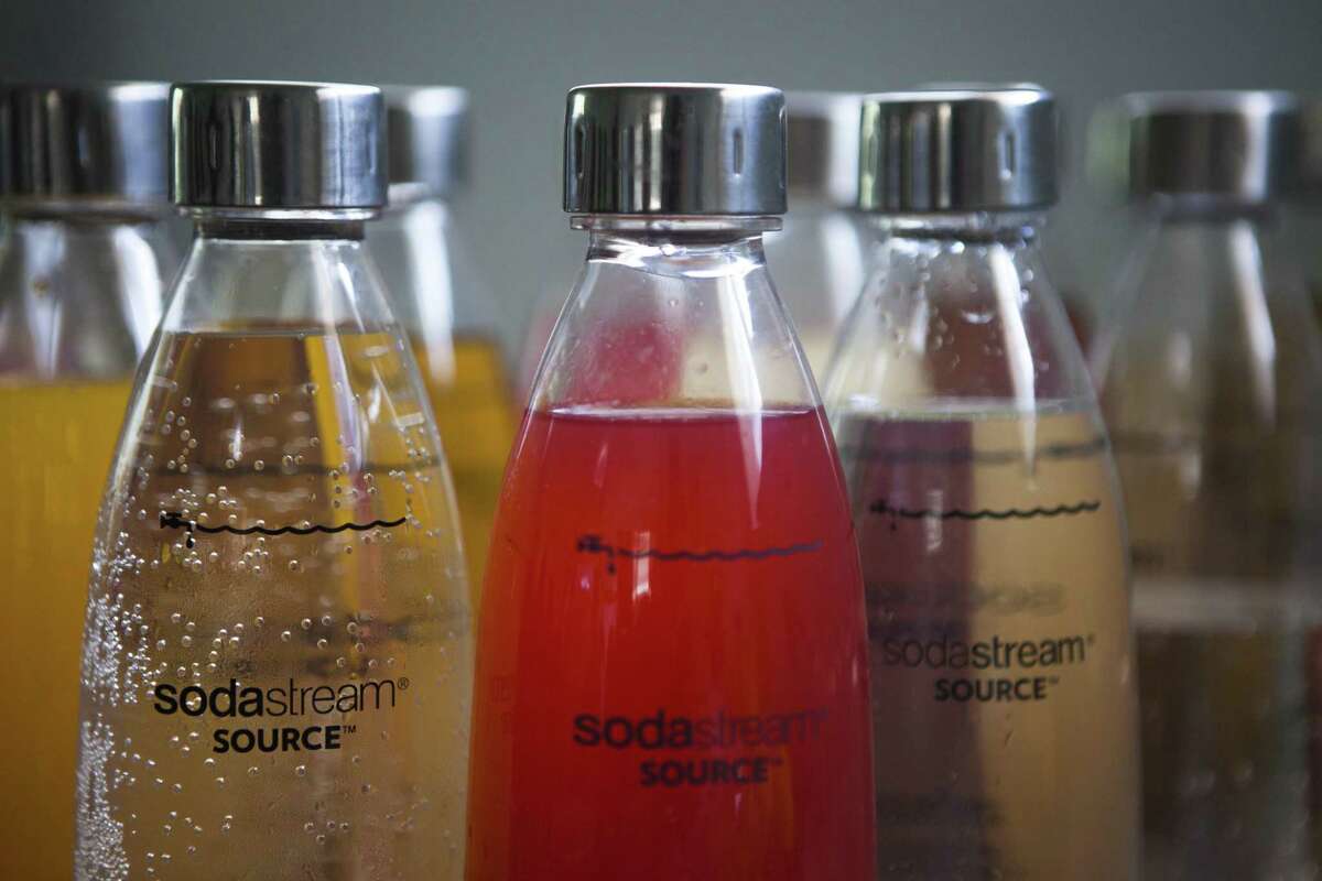 In this Sept. 2, 2015 file photo, SodaStream products are seen at the SodaStream factory near the Bedouin city of Rahat, Southern Israel. Beverage giant PepsiCo has bought Israel's fizzy drink maker SodaStream for $3.2 billion. PepsiCo said on Monday, Aug. 20, 2018, that it is acquiring all SodaStream's outstanding shares at $144 per share, a 32 percent premium to the 30-day volume weighted average price.