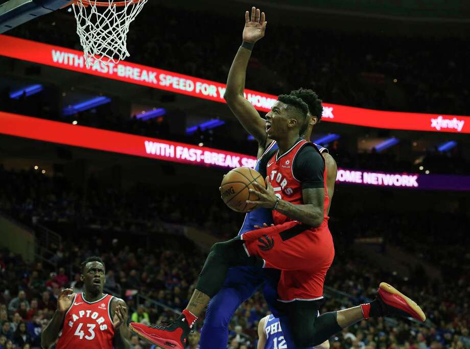 Bruno Caboclo drives to the basket against the 76ers Photo: Associated Press, AP / FR27227 AP