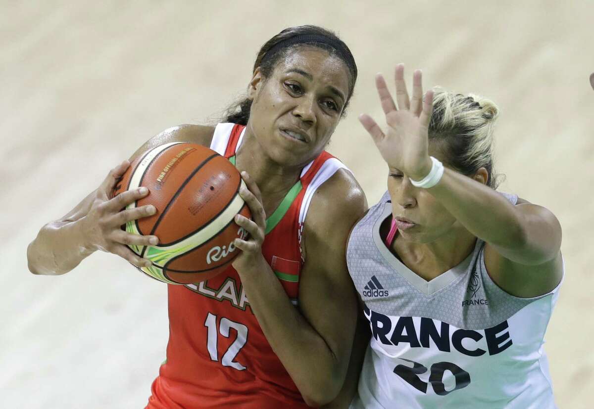 Belarus guard Lindsey Harding (12) runs into France guard Amel Bouderra (20) during the first half of a women's basketball game at the Youth Center at the 2016 Summer Olympics in Rio de Janeiro, Brazil, Sunday, Aug. 7, 2016. (AP Photo/Carlos Osorio)