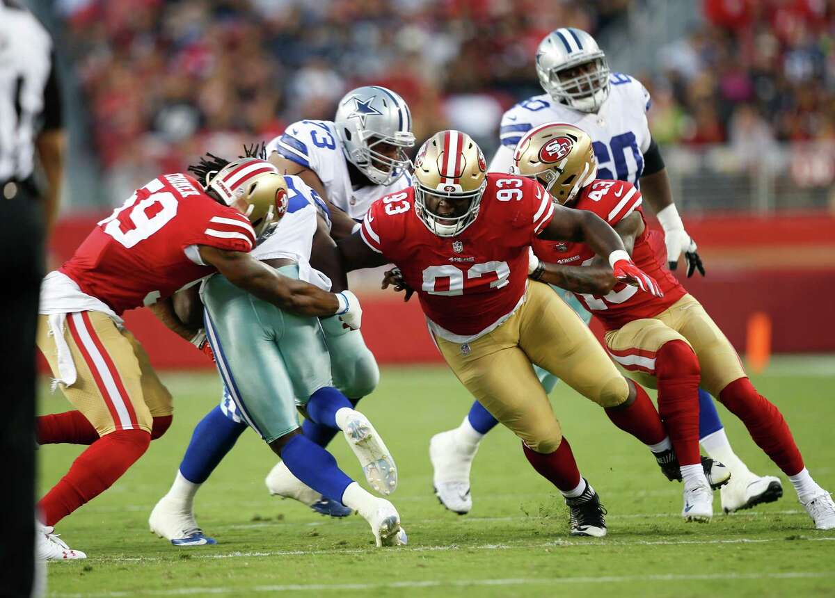 SANTA CLARA, CA - AUGUST 9: Korey Toomer #59 and D.J. Jones #93 of the San Francisco 49ers make a tackle during the game against the Dallas Cowboys at Levi Stadium on August 9, 2018 in Santa Clara, California. The 49ers defeated the Cowboys 24-21. (Photo by Michael Zagaris/San Francisco 49ers/Getty Images)