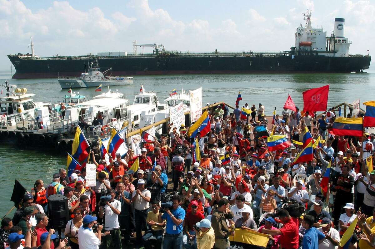 Striking oil workers of Petroleos de Venezuela, SA (PDVSA) hold their daily meeting in front of anchored oil ship Morichal in Maracaibo Lake in western Venezuela, Sunday, Jan. 5, 2003. The strike has paralyzed oil exports and helped drive international oil prices above $30 a barrel. Venezuela is the world's fifth-largest oil exporter and a top supplier to the United States. (AP Photo/Ana Maria Otero) HOUCHRON CAPTION (01/22/2003): Petroleos de Venezuela workers on strike meet near the oil tanker Morichal on Lake Maracaibo in western Venezuela earlier this month. The strike has forced crude prices to their highest levels since November 2000. HOUCHRON CAPTION (06/29/2003): Striking Petroleos de Venezuela workers met near the oil tanker Morichal on Lake Maracaibo in western Venezuela early this year. The strike, unsuccessfully aimed at ousting President Hugo Chavez, paralyzed the country's oil industry and led to the firing of 18,000 oil workers.