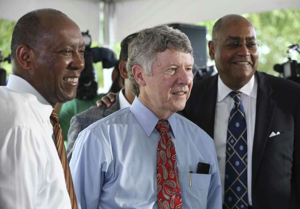 Houston Mayor Sylvester Turner, from left, Harris County Judge Ed Emmett, Harris County Commissioner Rodney Ellis pose for a photograph after a press conference to rally for Proposition A in the upcoming Harris County Flood Control District Bond Election on the banks of White Oak Bayou at TC Jester Park on Thursday, Aug. 9, 2018, in Houston. The Harris County leaders ask county residents to vote for the $2.5 billion bond proposal to help finance a 10- to 15-year program of flood mitigation projects.