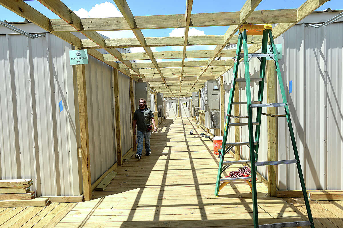 Construction continues at the new portables which will serve Vidor Middle School sixth graders and staff at the Vidor Junior High School campus. Fifth graders will be in portables at the high school. The middle school was one of two campuses Vidor ISD lost in Harvey's flooding, and the district is still awaiting word from FEMA on how much they will receive to remodel or build anew. The 10 portable units started arriving in June, and construction crews have been putting them together within the last two weeks, doing the plumbing and electrical work and building covered walkways connecting the units. Last year, the district shuffled its two closed campuses among other school buildings, sharing rooms and other facilities in the wake of Harvey's flooding. This year, sixth graders will be at the portables, which they anticipate will be the case for at least 2 years. Monday, August 20, 2018 Kim Brent/The Enterprise