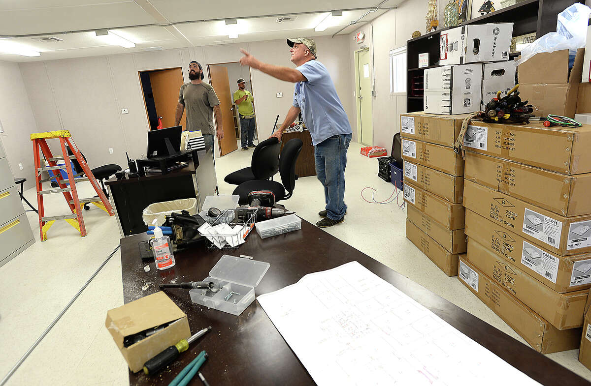 Todd Dixon (left) and Everette Smith with Knost Electric work on installng the fire alarms in the portable office as construction continues at the new portables which will serve Vidor Middle School sixth graders and staff at the Vidor Junior High School campus. Fifth graders will be in portables at the high school. The middle school was one of two campuses Vidor ISD lost in Harvey's flooding, and the district is still awaiting word from FEMA on how much they will receive to remodel or build anew. The 10 portable units started arriving in June, and construction crews have been putting them together within the last two weeks, doing the plumbing and electrical work and building covered walkways connecting the units. Last year, the district shuffled its two closed campuses among other school buildings, sharing rooms and other facilities in the wake of Harvey's flooding. This year, sixth graders will be at the portables, which they anticipate will be the case for at least 2 years. Monday, August 20, 2018 Kim Brent/The Enterprise
