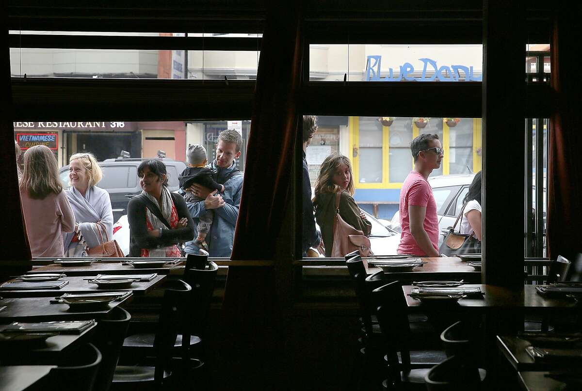 A line waits outside of Burma Superstar before it opens for dinner in San Francisco, California, on Friday, May 1, 2015.