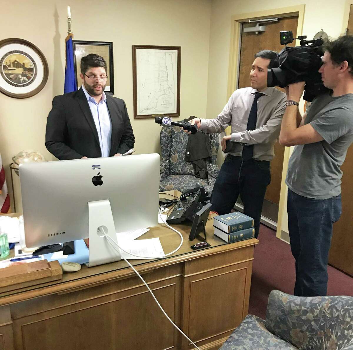 Middletown Mayor Dan Drew speaks to reporters in his office immediately following the Common Council meeting Aug. 13. That night, Attorney Margaret Mason read the report of her investigation into alleged gender bias involving a city Board of Education member who said he intervened in her raise.