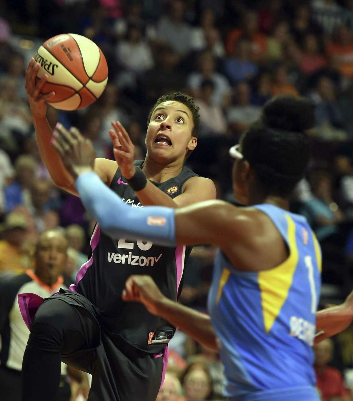 Connecticut Sun guard Layshia Clarendon, left, drives to the basket as Chicago Sky guard Diamon DeShields defends in the second half on Aug. 12.