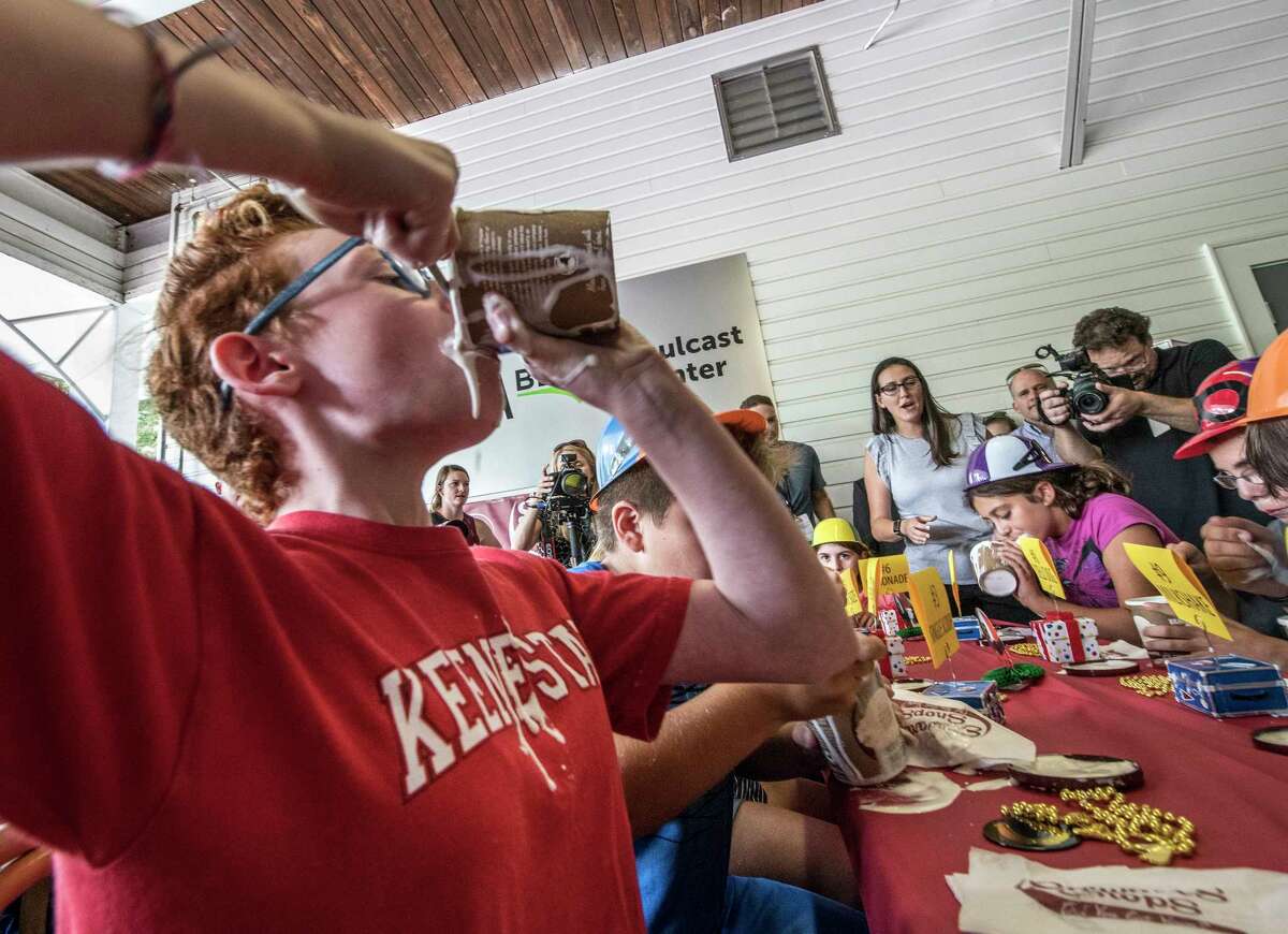 Eleven year old Lucy Holland, 11 of Katonah tried her best to down a pint of Stewart's Ice Cream during an ice cream eating contest Wednesday Aug. 22, 2018 at the Saratoga Race Course in Saratoga Springs, N.Y. She finished second by a nose. (Skip Dickstein/Times Union)