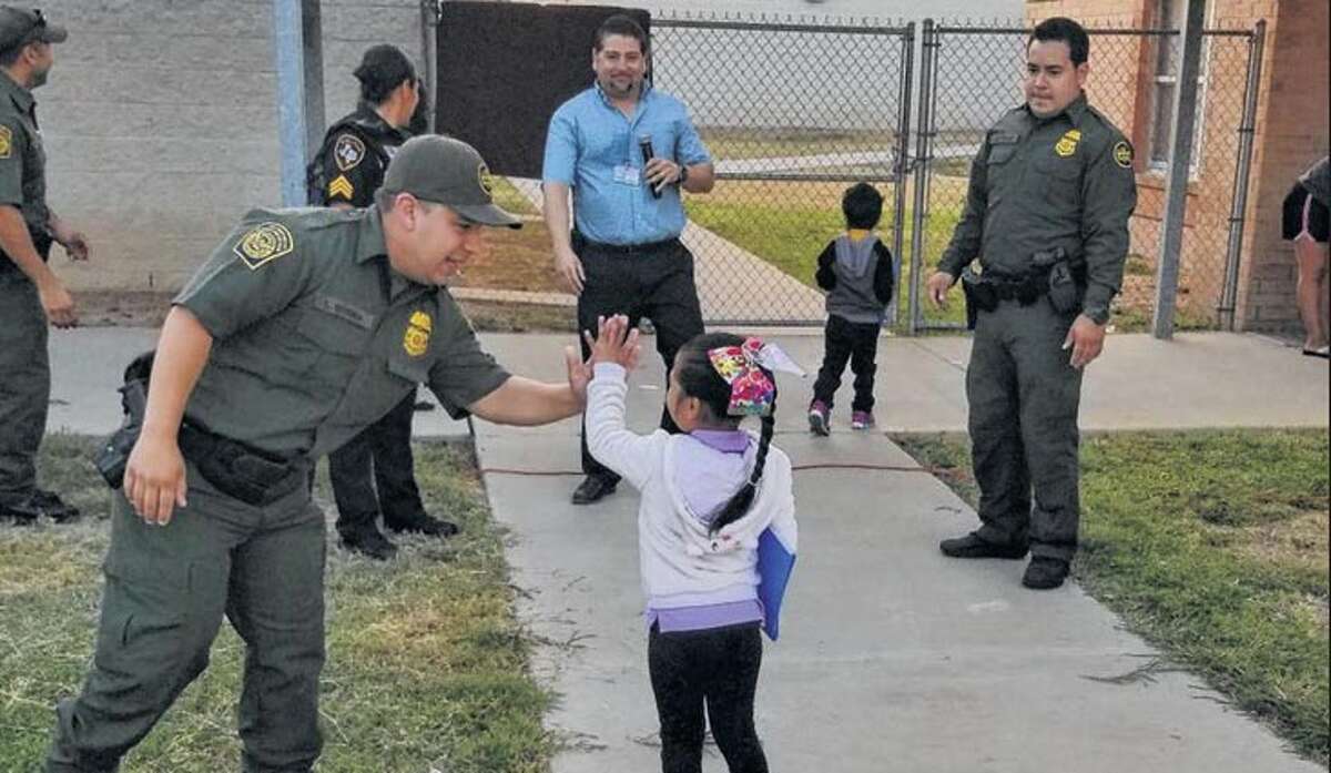 Border Patrol agents from the Laredo Sector Border Community Liaison Program welcomed students back to school at the entrances of Milton Elementary, Malakoff elementary and Farias Elementary.
