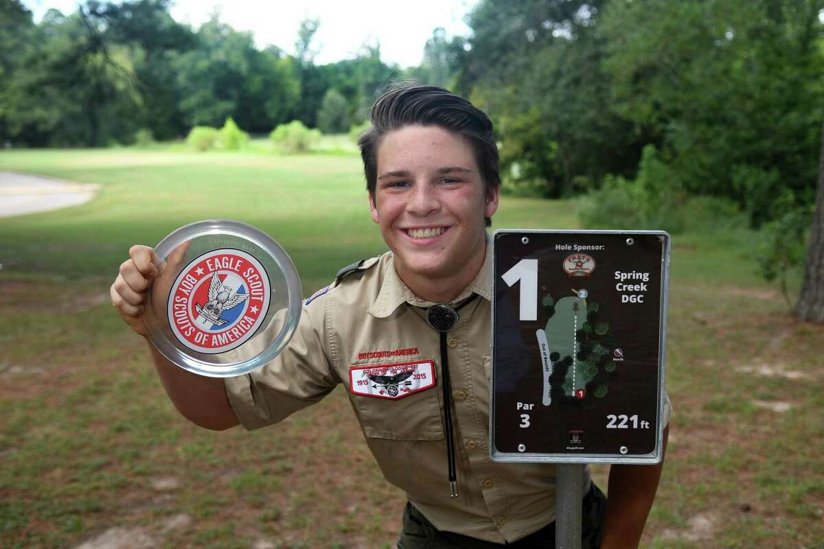 Carter Monrad, 16, a junior at Tomball High School, prepares to make a ceremonial first throw on August 18, 2018, during the opening of the disc golf course that he created at Spring Creek Park as part of an Eagle Scout project.