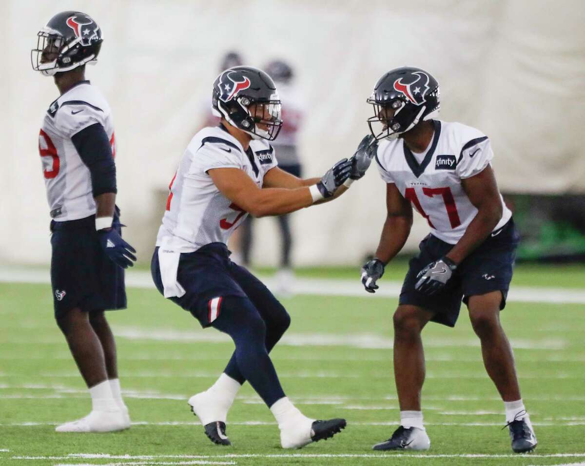 Houston Texans linebackers Dylan Cole (51) and Kennan Gilchrist (47) run a drill during training camp at the Methodist Training Center on Thursday, Aug. 23, 2018, in Houston.