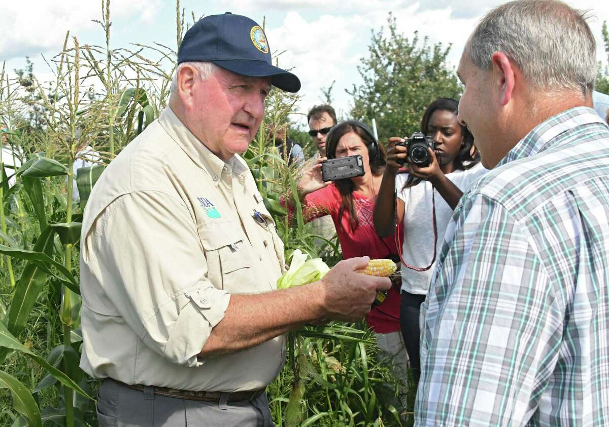 U.S. Secretary of Agriculture Sonny Perdue, left, talks to farm owner John Altobelli, right, as he takes a tour of the Altobelli Family Farm on Thursday, Aug. 23, 2018 in Valatie, N.Y. (Lori Van Buren/Times Union)