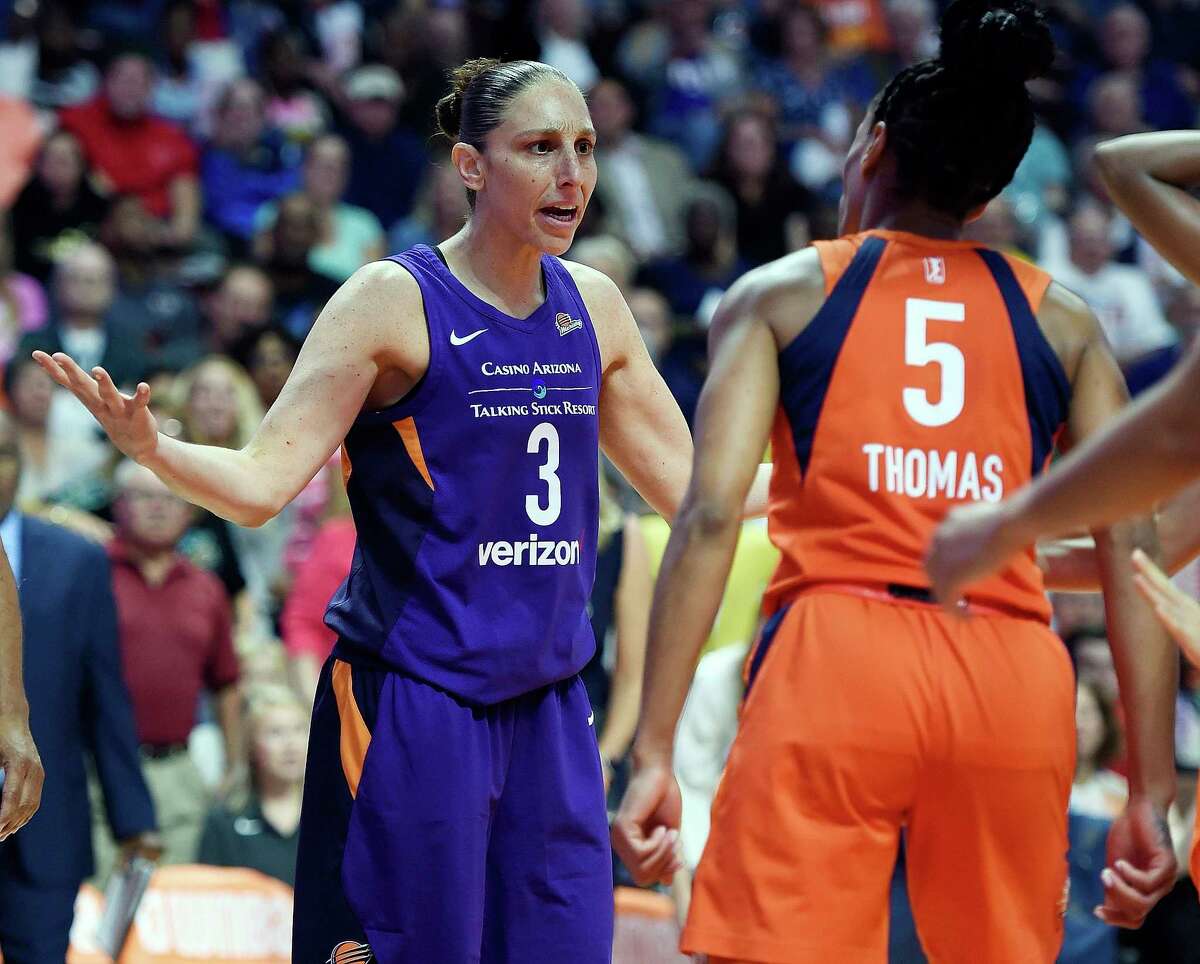 Connecticut Sun guard Jasmine Thomas (5) confronts Phoenix Mercury guard Diana Taurasi after being fouled during the first half of a single-elimination WNBA basketball playoff game Thursday, Aug. 23, 2018, in Uncasville, Conn. (Sean D. Elliot/The Day via AP)