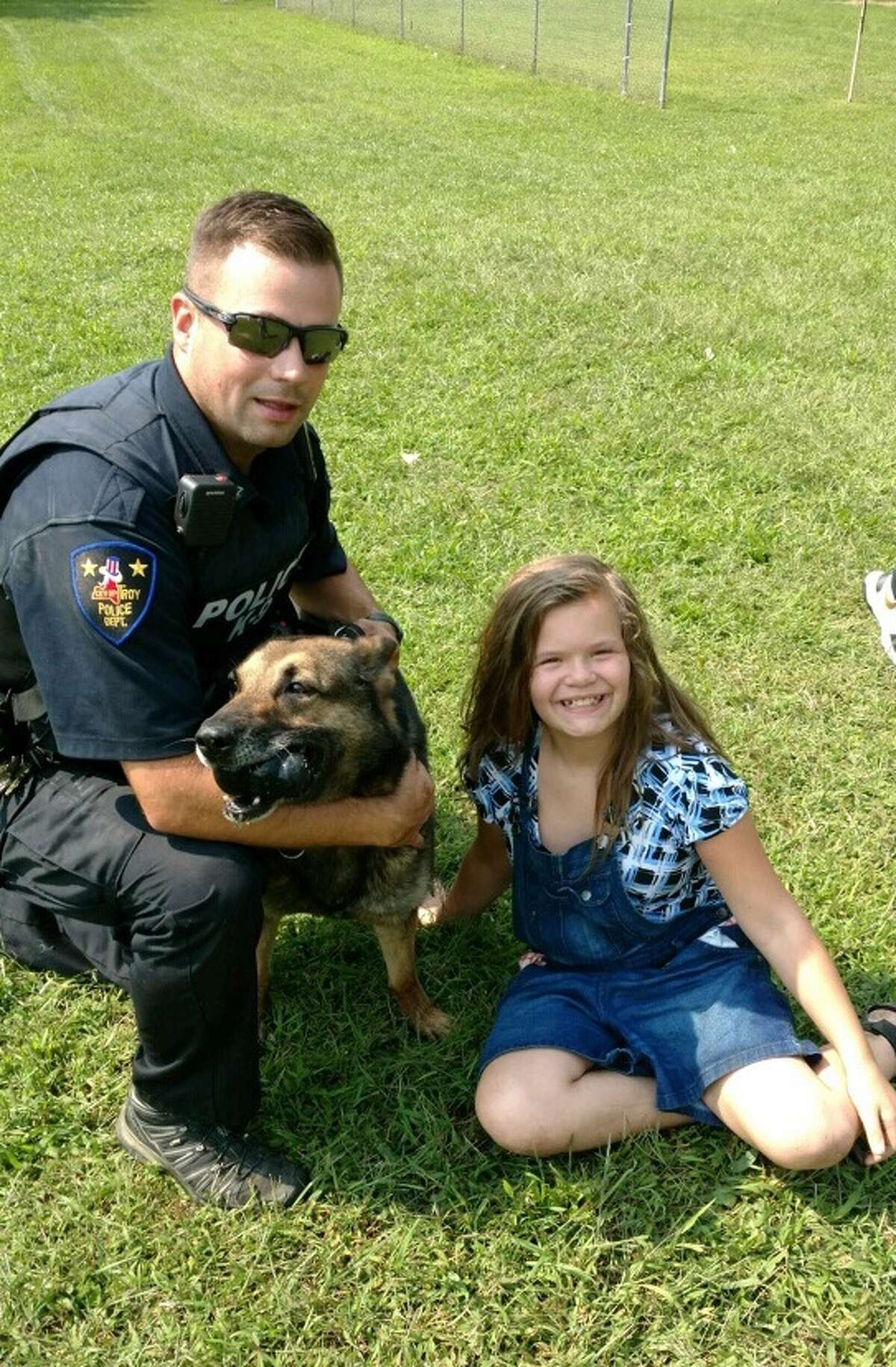 Troy Canine Officer Kyle Jones, K9 Blair and the located missing person. (Courtesy Troy Police Department)