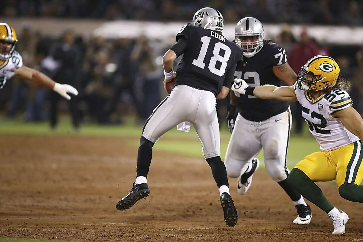 Green Bay Packers linebacker Clay Matthews (52) applies pressure to Oakland Raiders quarterback Connor Cook (18) during the first half of an NFL preseason football game in Oakland, Calif., Friday, Aug. 24, 2018. (AP Photo/Ben Margot)