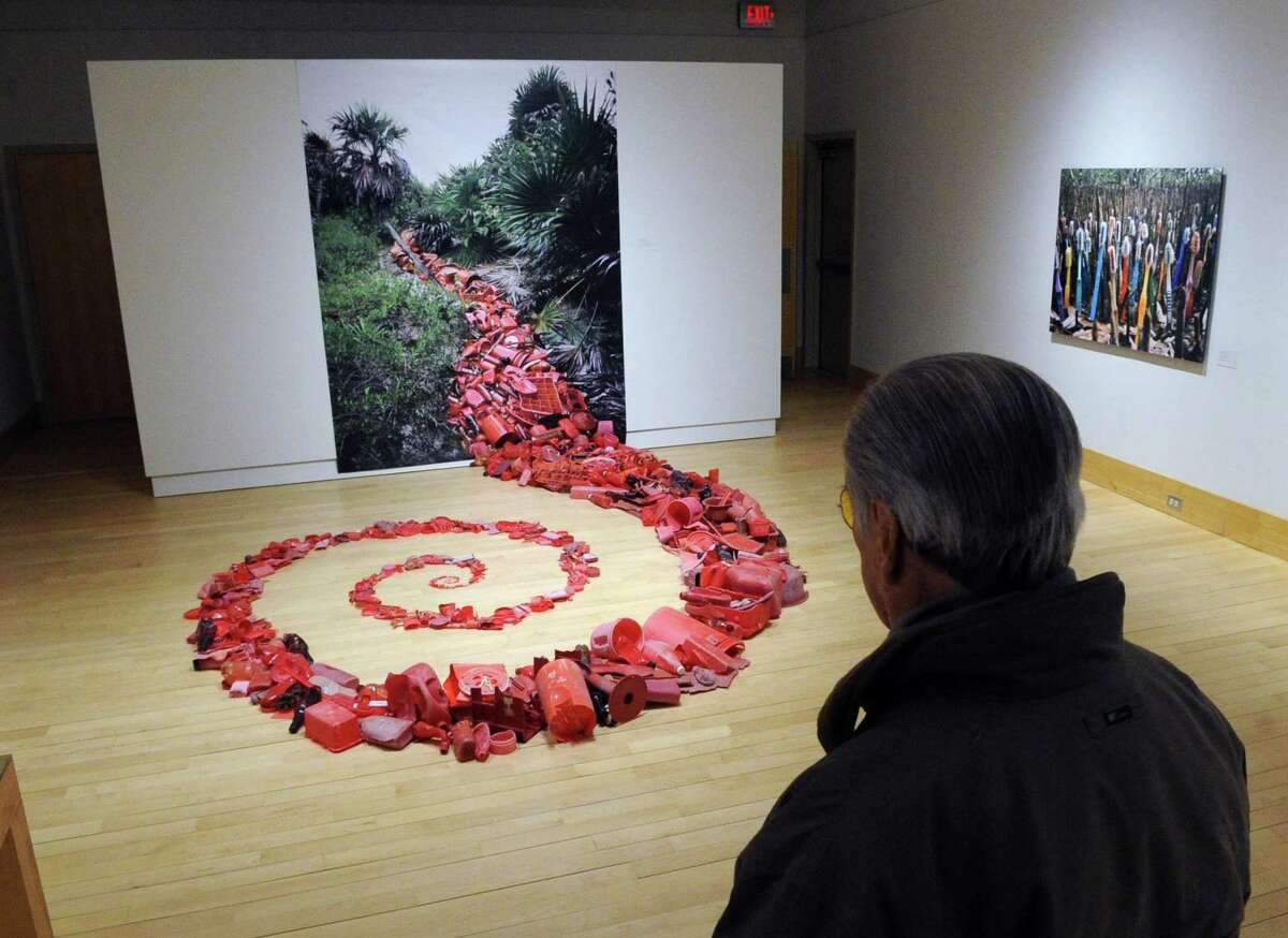 The opening night of the exhibition "Hazardous Beauty," at the Flinn Gallery at the Greenwich Library on March 15. The show, which featured the striking work of environmental artists Alejandro Duran and Willie Cole, is one of dozens held over the past nine decades at the gallery.