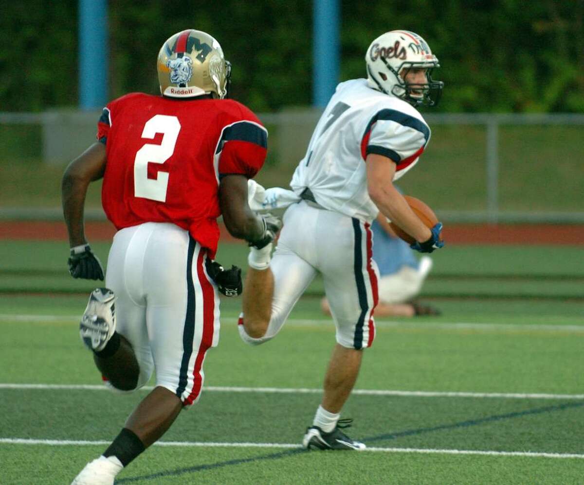 New Haven County's #7 Paul Piccirillo runs to the endzone for a touchdown, during New Haven County vs. Fairfield County all-star football action in West Haven, Conn. on Friday July 09, 2010.
