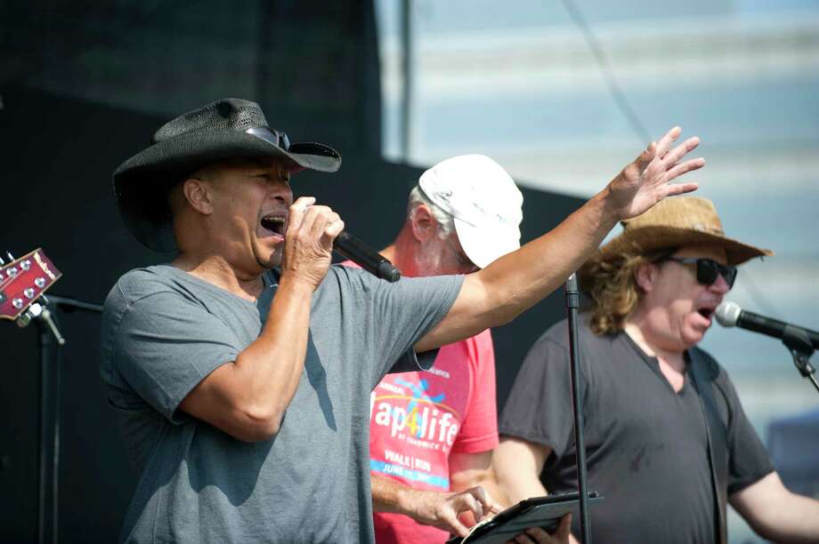 gary lee, lead vocalist for band jump the gunn, sings during the