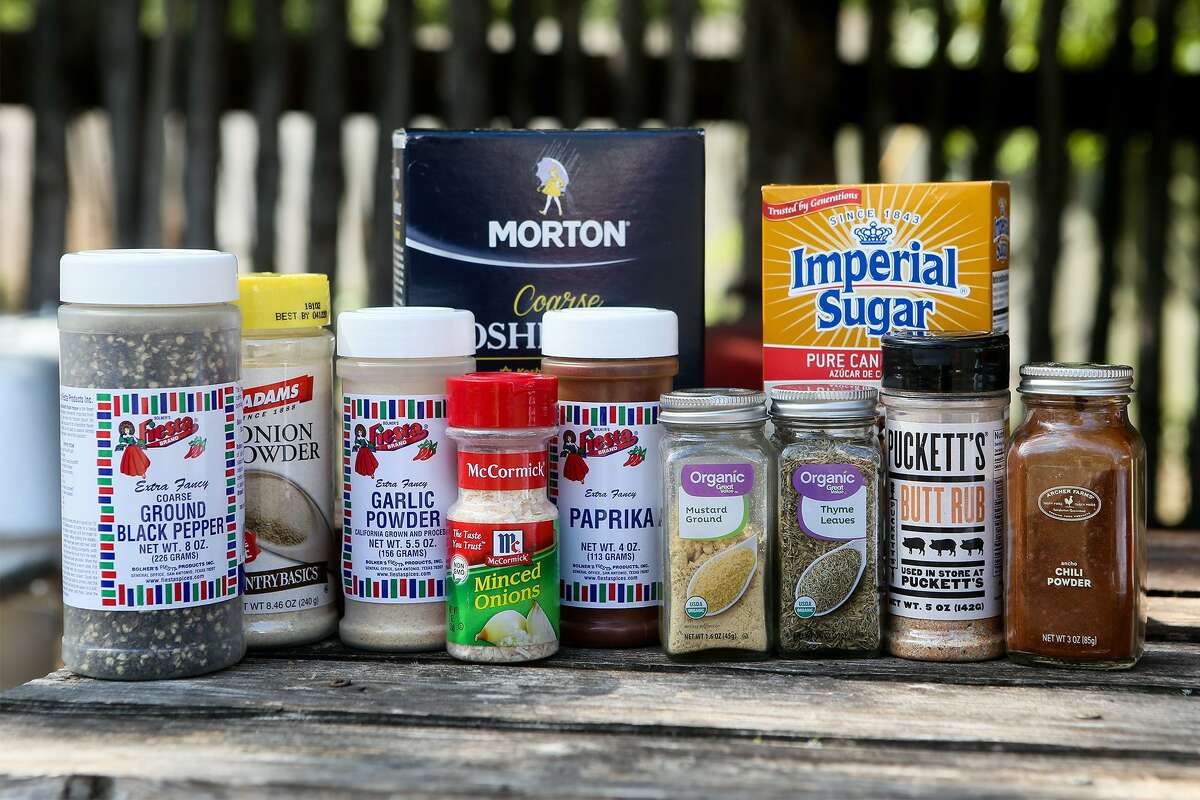 An assortment of traditional spices that Chuck Blount suggests to put into your BBQ toolbox include: ground black pepper (from left), onion powder, garlic powder, kosher salt, minced onions, paprika, ground mustard, thyme leaves, brown sugar, dry rub and chili powder.
