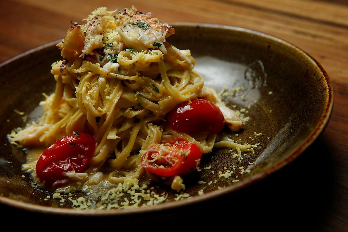 Linguine Granchio consisting of parsley-studded linguine, dungeness crab meat, lemon zest, tomatoes and olive oil at Pasta Pop Up, Thursday, April 12, 2018, in San Francisco, Calif. The Italian restaurant is located at 550 Green Street.