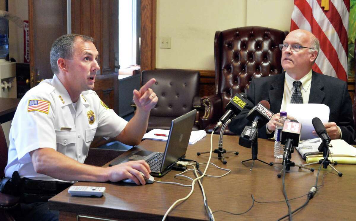 Saratoga Springs Police Chief Greg Veitch, left, and Public Safety Commissioner Chris Mathiesen show a video relating to the Darryl Mount Jr. case during a news conference at City Hall Friday June 20, 2014, in Saratoga Springs, NY. (John Carl D'Annibale / Times Union)