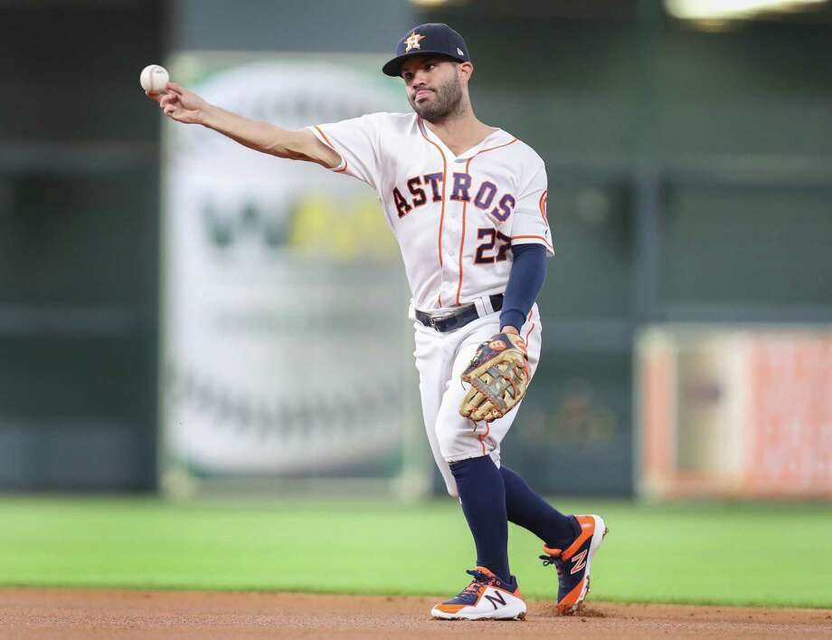 Houston Astro's second baseman Jose Altuve (27) ejects Oakland Athletics left fielder Khris Davis (2), who will launch a MLB game at Minute Maid Park on Monday, August 27, 2018 in Houston. Houston Astros second baseman Jose Altuve (27) throws Oakland Athletics left fielder Khris Davis (2) outduring an MLB game at Minute Maid Park Monday, August 27, 2018, Photo: Steve Gonzales, Staff Photographer © 2018 Houston Chronicle