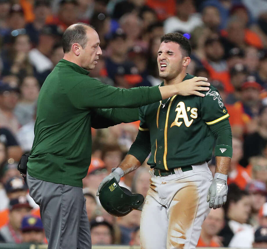 Oakland Athletics midfielder Ramon Laureano (22) is tested by the coach during a MLB match at Minute Maid Park on Monday, August 27, 2018 in Houston. Photo: Steve Gonzales, Staff Photographer / © 2018 Houston Chronicle