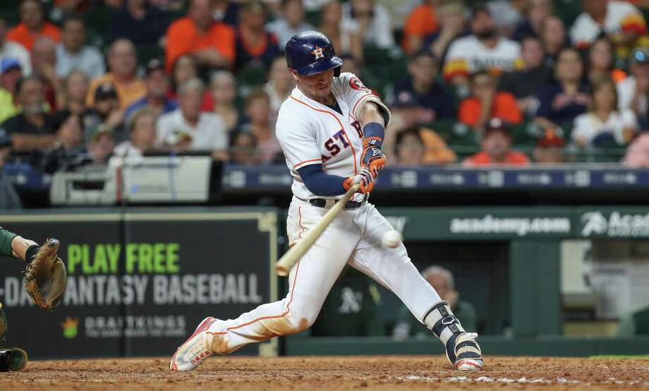 Alex Bregman (2), the third baseman of Houston Astros, launches a homer in the 8th inning of a MLB game on August 27, 2018 in Houston. Houston Chronicle