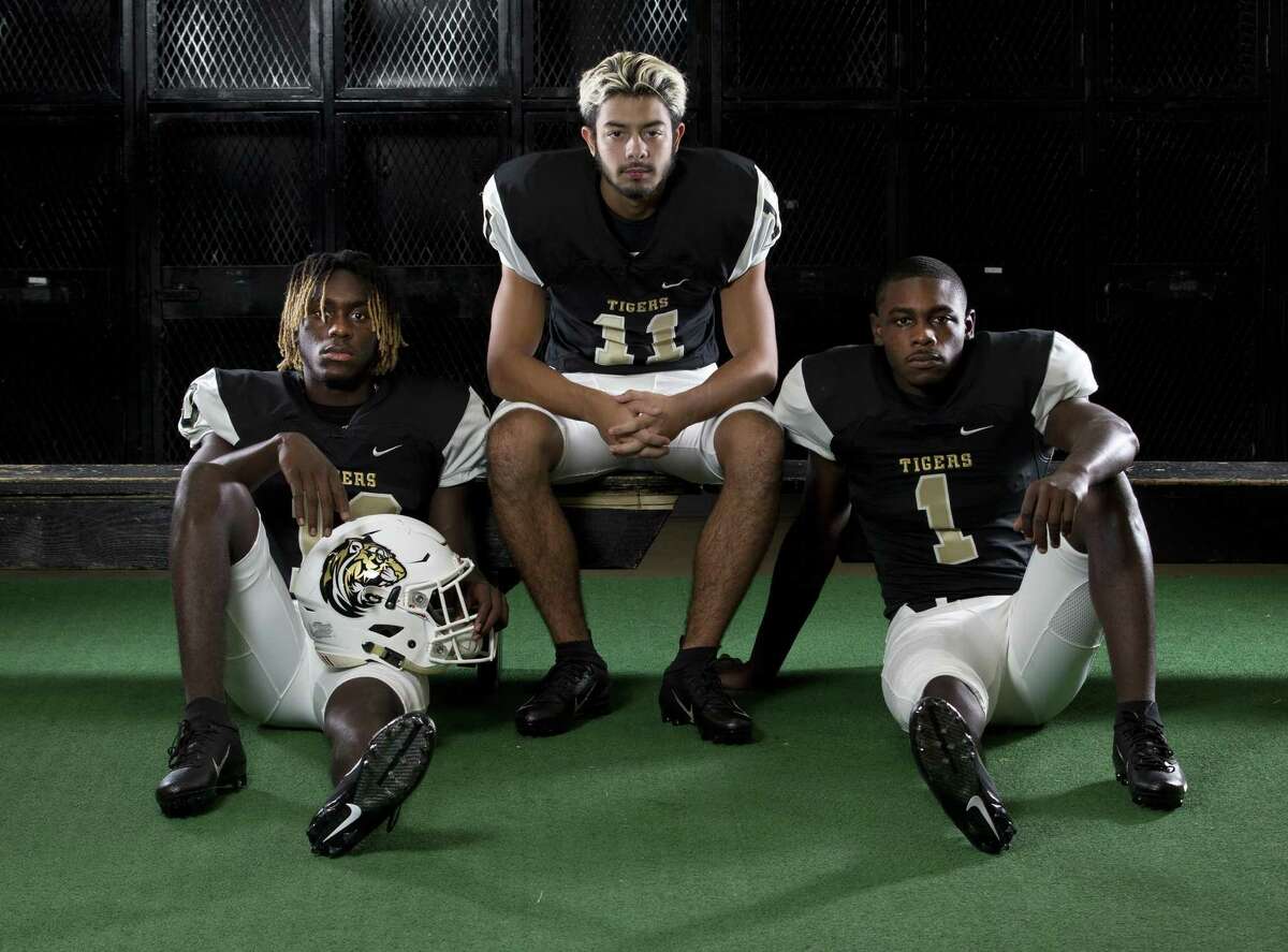 Conroe football seniors (from left) Jay Smith, Michael Gutierrez and Coco Sneed.