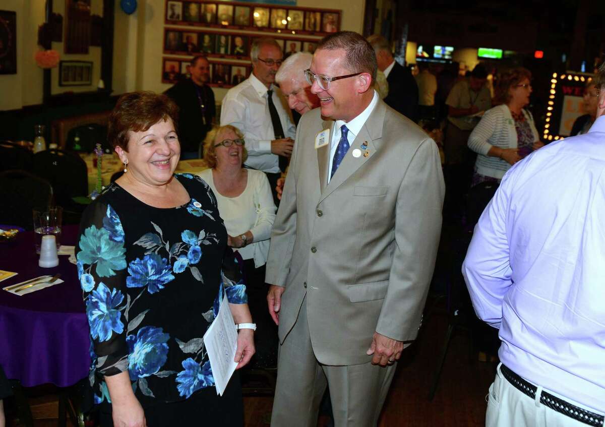 Derby Centennial Lions Club President Anita Dugatto, left, chats with International Director of Lions Club International Mark Lyon during its Charter Night Dinner at The Benevolent & Protective Order of Elks Lodge #571 in Derby, Conn., on Saturday July 14, 2018. Shaukat Khan, the Lions district director, presented the charter to Dugatto, the club's first president and Derby's former two-term mayor.
