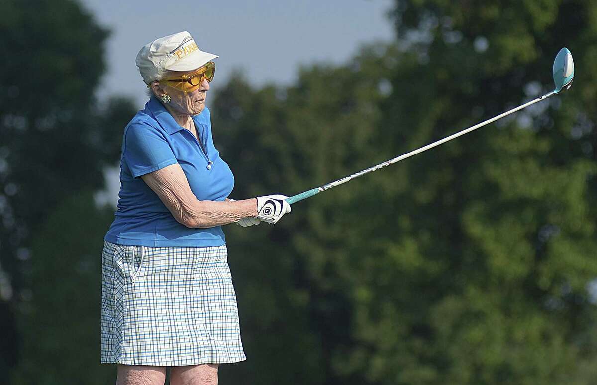 Ninety-year-old Caryl Beatus tees off on the 12th hole at the Longshore Golf Course in Westport on Tuesday morning, during the second annual Caryl Beatus Tournament, named in her honor. Beatus, a longtime resident of Westport, is one of the founding members of the Longshore Women's Golf Association, which started in 1960.