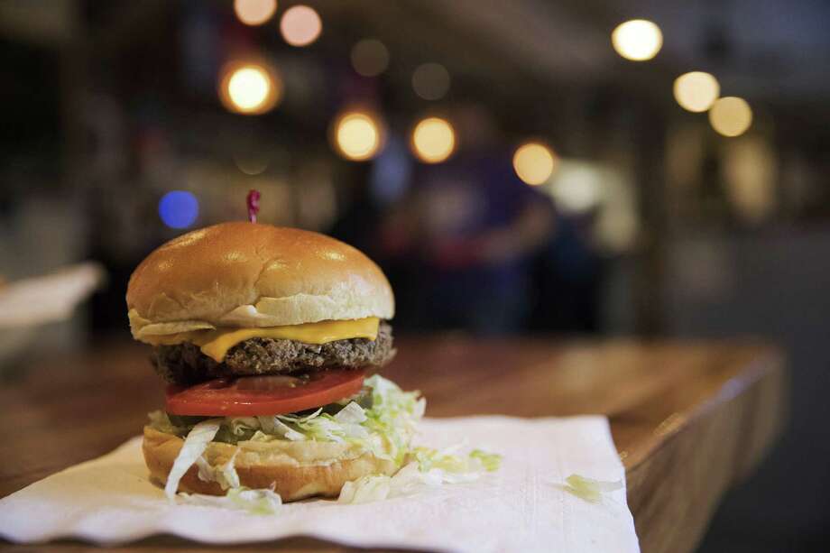 Impossible Foods makes a meat-free hamburger made from vegetable proteins. Impossible Foods Inc., the Silicon Valley-based alternative meat company, known for its veggie burger that tastes, smells and even bleeds like the real one, takes a big step forward with a small cake. The Impossible Slider will debut nationwide on Wednesday at 377 White Castle locations in the United States on Sept. 12. Photo: Ryan Soderlin / Associated Press / OMAHA WORLD-HERALD