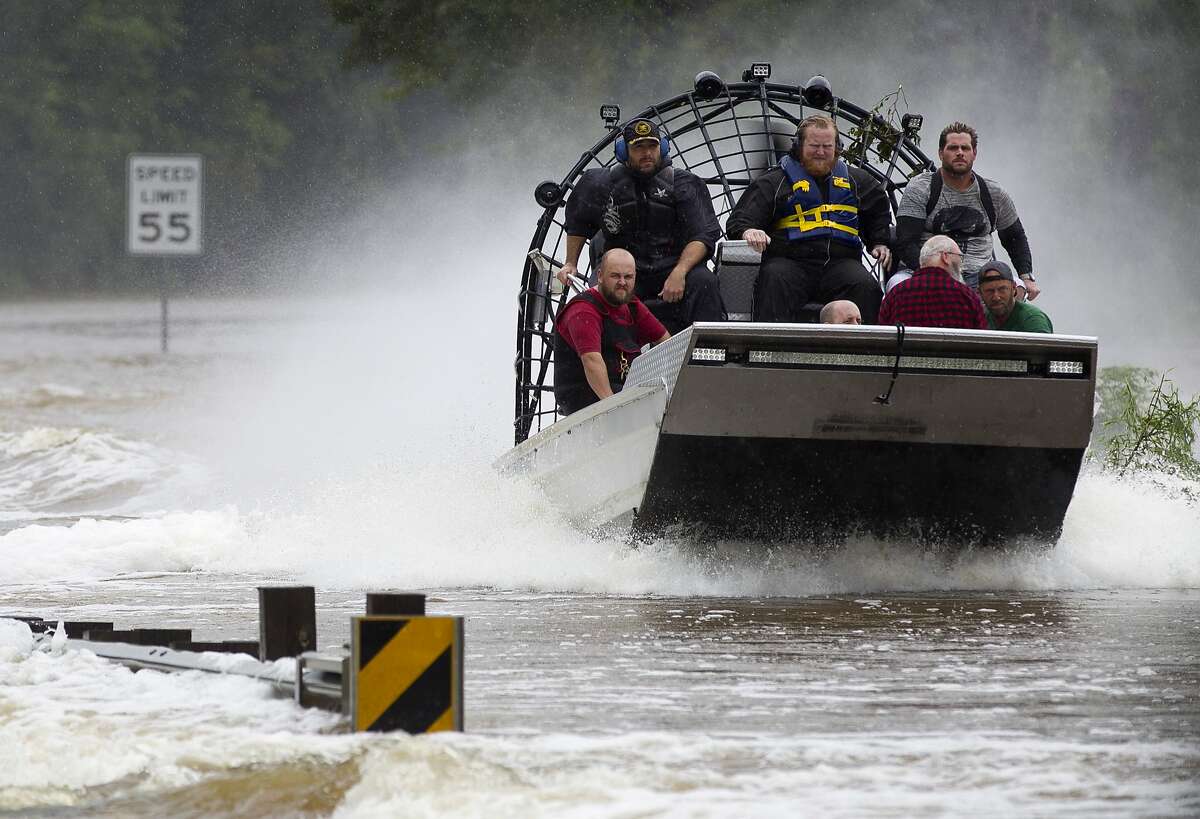 Residents are evacuated from their homes by airboat across the San Jacinto River on FM 1485, Tuesday, Aug. 29, 2017, in New Caney. Members of the Cajun Navy, a volunteer civilian group that helps those affected by disasters, helped with rescue and recovery efforts in East Montgomery County.