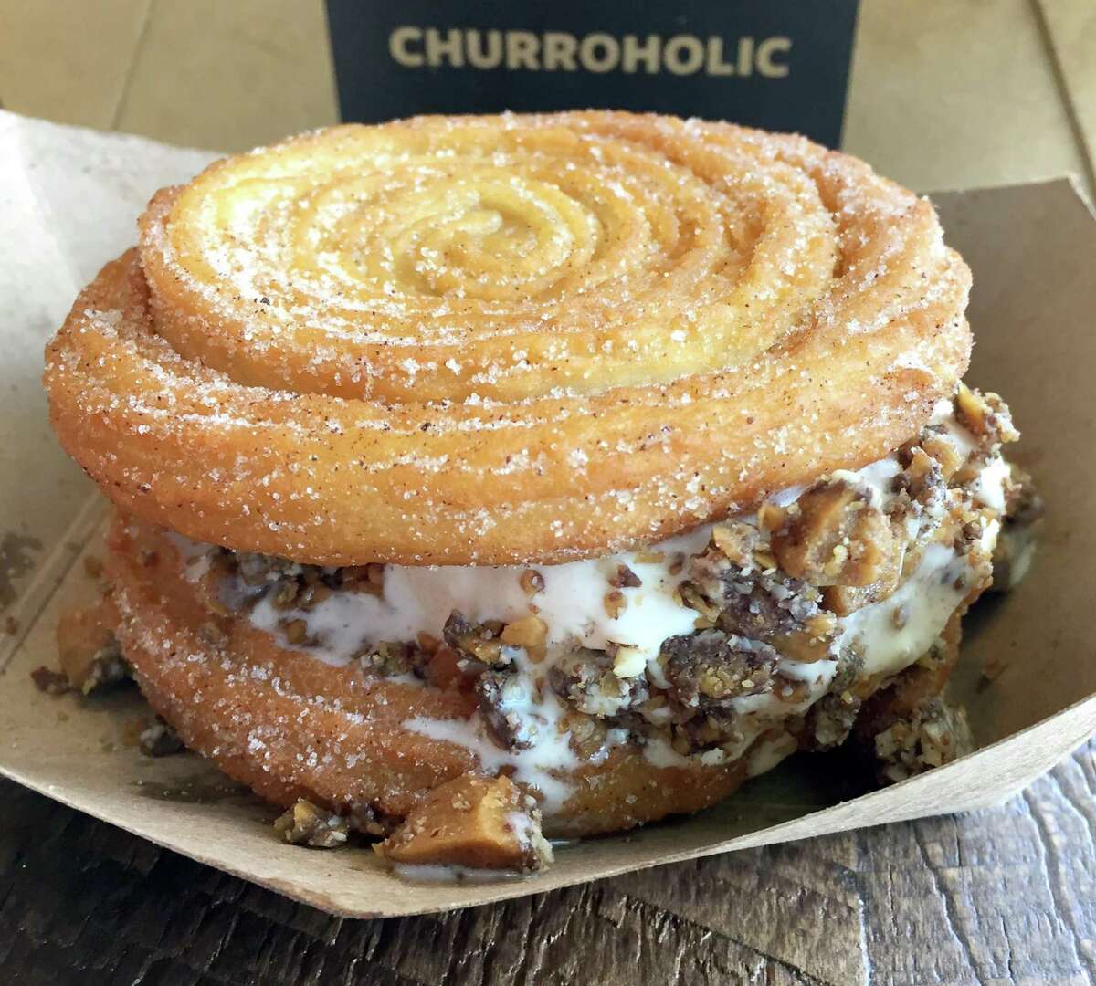 A Churro Sandwich made with horchata ice cream and toffee crumbles from Churroholic.