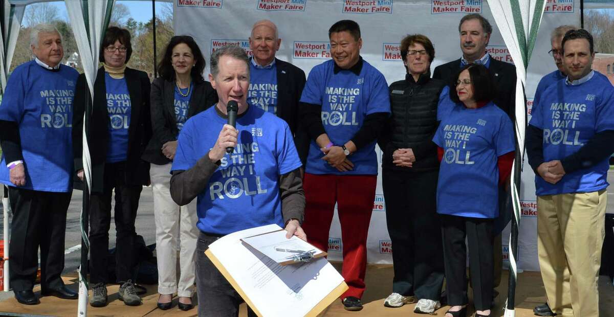 Mark Mathias, foreground, one of the Westport Mini Maker Faier organizers, is joined by local officials and supporters at the start of the fourth annual event Saturday.