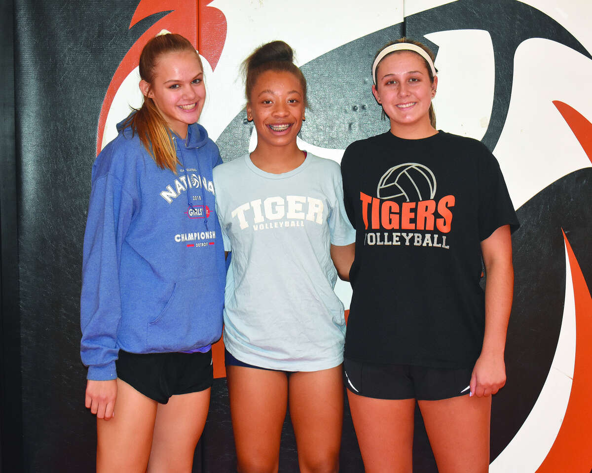 Returning members of the Edwardsville girls’ volleyball team include Storm Suhre, left, Alexa Harris, middle, and Corrine Timmermann, who is the lone senior on the team.