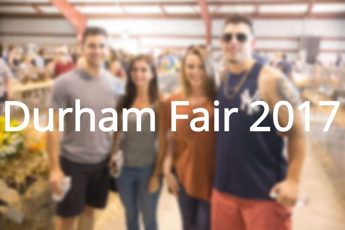Crowds enjoyed summer-like conditions Saturday during the 98th annual Durham Fair, having fun at the midway rides and games, trying out food of all sorts, visiting the Discovery Tent, listening to live music and checking out the various livestock barns at the fairgrounds.