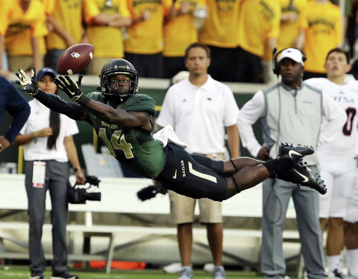 In this Sept. 9, 2017, file photo, Baylor wide receiver Chris Platt (14) reaches for an incomplete pass against UTSA during the first half of an NCAA college football game in Waco, Texas. Platt and nine other fifth-year seniors who first arrived on the Waco campus with the program at the peak of its on-field success are now set to start their final season after tumultuous times filled with criticisms of the program and the schools first 11-loss season.
