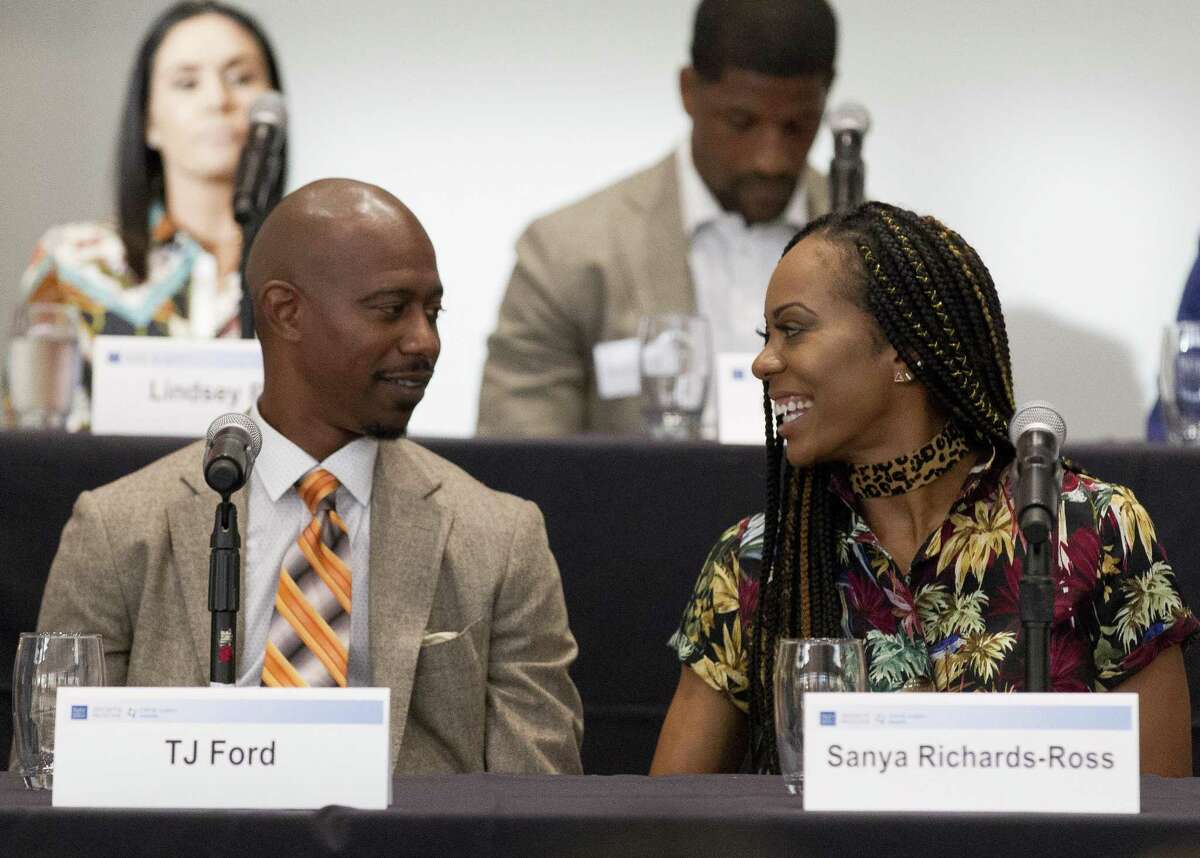 Former NBA player T.J. Ford and Olympic gold medalist Sanya Richards-Ross speak during the Going Pro sports forum at The Woodlands Country Club on Wednesday, Aug. 29, 2018, in The Woodlands. The annual event comprised of athletes, health care providers and others from the sports industry offered advice and answered questions about college recruitment and competing at the professional level.