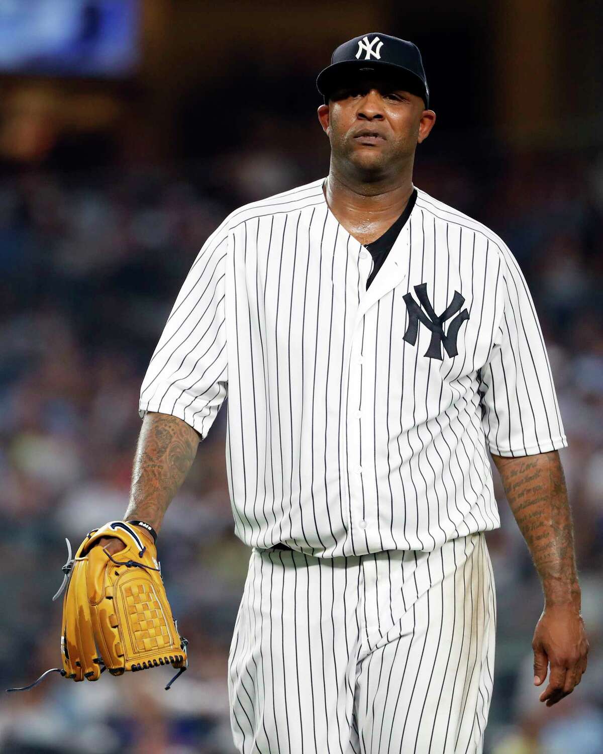 NEW YORK, NY - AUGUST 29: CC Sabathia #52 of the New York Yankees walks back to the dugout against the Chicago White Sox during the second inning at Yankee Stadium on August 29, 2018 in the Bronx borough of New York City. (Photo by Adam Hunger/Getty Images)