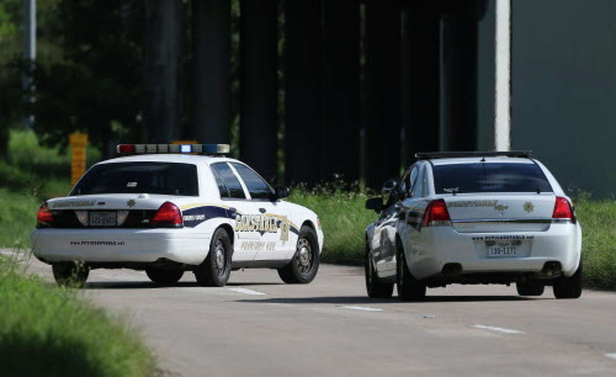 Harris County Precinct One officers block the ramp connecting Eastex Freeway Service Road to Interstate Highway 69 North/United States Highway 59 nourthbound after a fatal motorcycle crash on Thursday, Aug. 30.